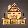 KAEMINGK Village de Noël en bois lumineux et musical à piles (27 x H24 cm) Chalet Suisse Coloré